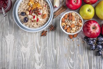 oatmeal with fruit and nuts, healthy breakfast, top view, copy space