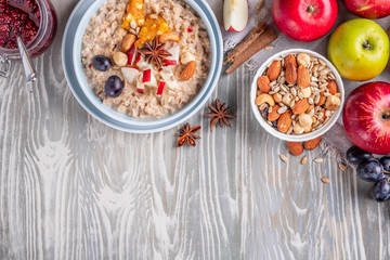 oatmeal with fruit and nuts, healthy breakfast, top view, copy space