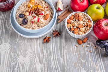 oatmeal with fruit and nuts, healthy breakfast, top view, copy space