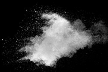 Explosion of white dust on black background.