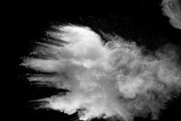 Explosion of white dust on black background.