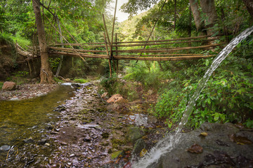 Budlaan waterfalls outdoor activities hiking along a river creek watercourse passing bamboo bridge, series of images in Cebu province