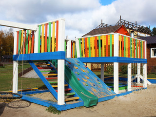 Fototapeta na wymiar Wooden Playground in the Park