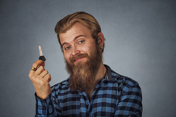 man holding car key or new apartment