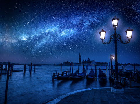 Fototapeta Milky way and falling stars over Grand Canal in Venice