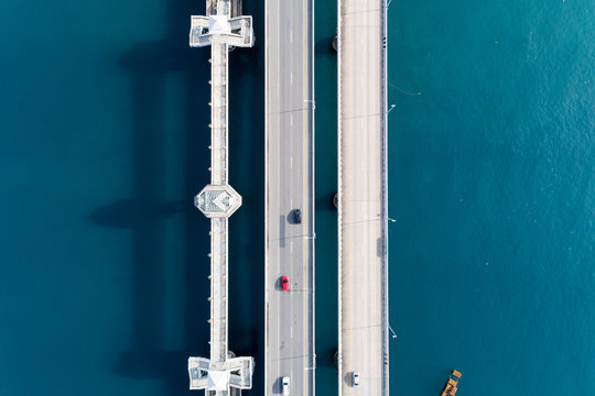 Aerial top view drone shot of bridge with cars on bridge road image transportation background concept