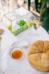 Wedding restaurant banquet decorations with flowers. Wedding arch andnewlyweds table with white background.