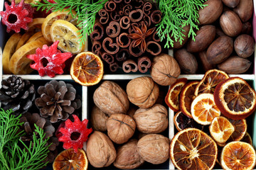 Box filled with christmas decoration and cypress branches