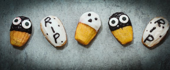 Homemade Halloween treats ghost Tombstone spooky Madeleines,Top view