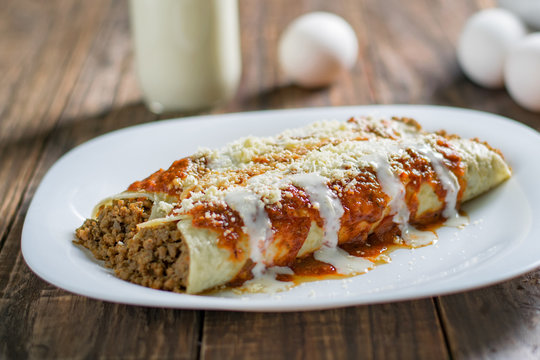 Delicious sliced pancakes with meat and tomato sauce