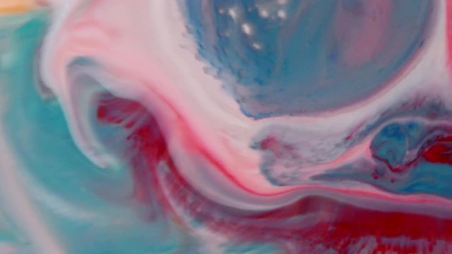 Abstract colorful paint, mixing and movement of multicolored paint in water. Multicolored acrylic paint. Fantastic surface.