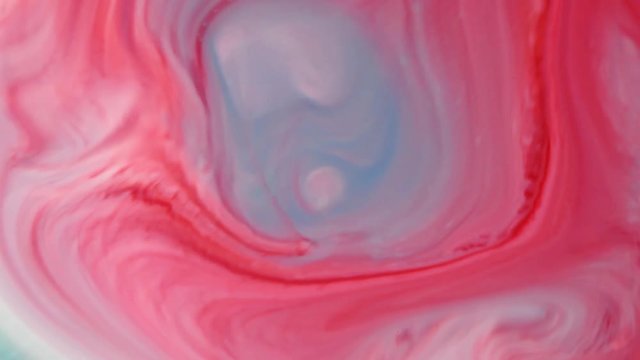 Abstract colorful paint, mixing and movement of multicolored paint in water. Multicolored acrylic paint. Fantastic surface.