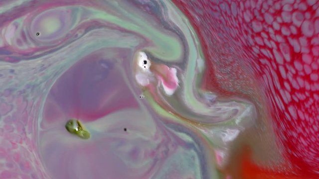 Abstract colorful paint, mixing and movement of multicolored paint in water. Multicolored acrylic paint. Fantastic surface.
