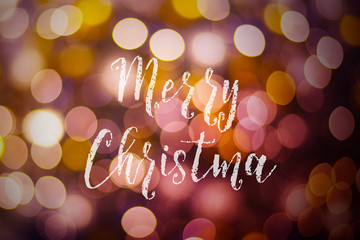 Merry Christmas and New Year typographical on pink gold sparkle bokeh or defocus  with Xmas card text
