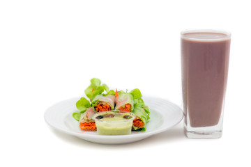 Salad and chocolate milk on breakfast