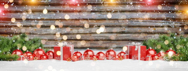 Red christmas baubles and gifts lined up 3D rendering