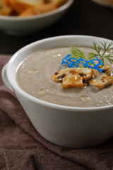 Cream soup with mushrooms in bowl