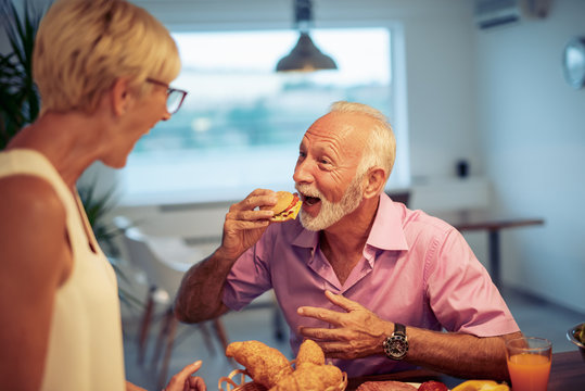 Senior Couple Eating Breakfast At Home