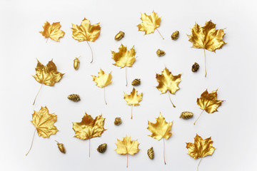 Fototapeta premium Autumn composition. Pattern made of autumn golden leaves on light background. Flat lay, top view