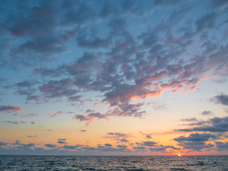 Beautiful sunset on the black sea in summer evening