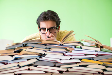 Student with too many books to read before exam