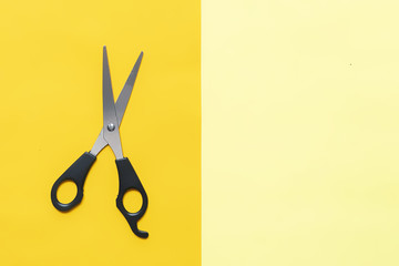 scissors isloated on double color yellow background creative copy space f