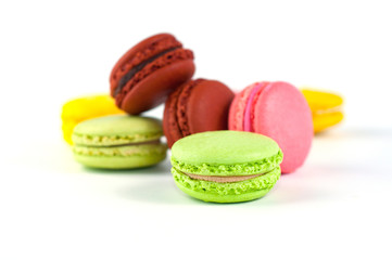 Macaron cakes of different colors on a white background
