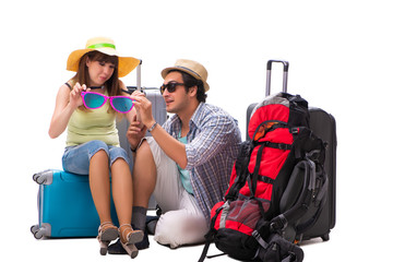 Obraz na płótnie Canvas Young family preparing for vacation travel on white