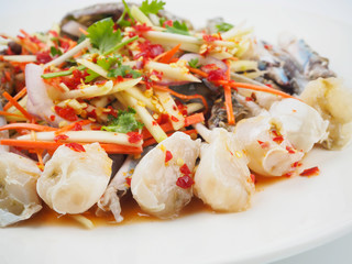 Thai style spicy salad with raw flower crab