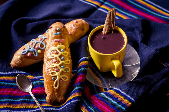 traditional dish and drink Ecuador, called: Colada Morada and bread guaguas