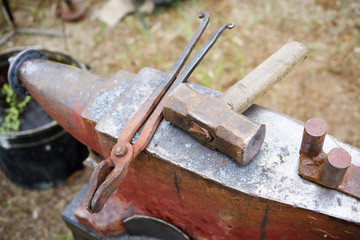 Anvil, hammer and tongs. Blacksmith tool