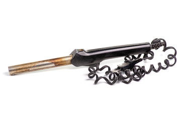 Old curling iron hair on a white background. Isolation