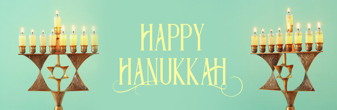 Banner of jewish holiday Hanukkah background with menorah (traditional candelabra) and burning candles.