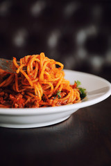 Spaghetti bolognese on wood background , italian food
