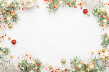 Christmas frame of spruce, red and gold decorations on white background. Copy space. New Year lights. Flat lay. - Powered by Adobe