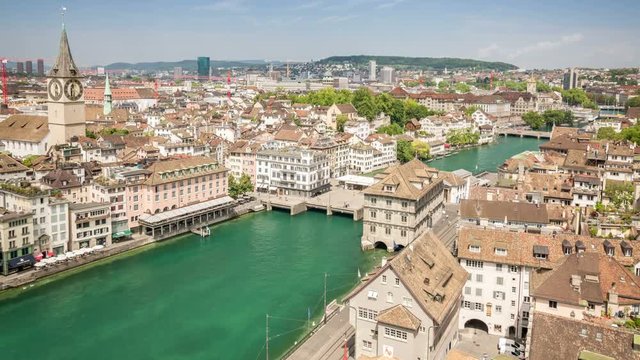 The old town Zurich split by the Limmat River. Aerial time lapse video.