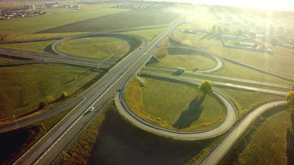 Aerial Top View of highway intersection junction summer morning with car