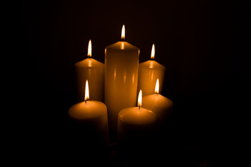 Candles lit with dark black background