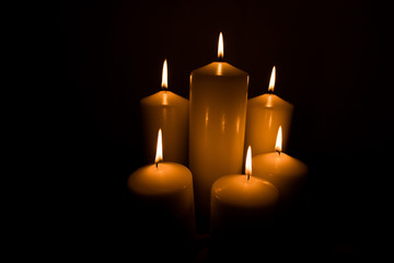 Candles lit with dark black background
