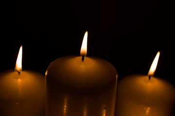 Candles lit with dark black background