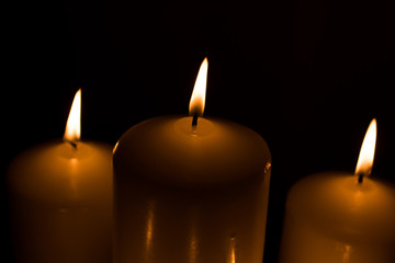 Candles lit with dark black background