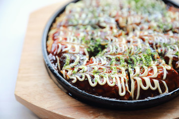 Japanese food okonomiyaki , Japanese pizza on wood plate