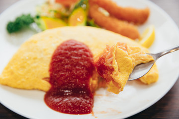 fried rice omelette on top and shrimp tempura japanese food style