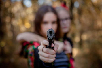 Teenagers in Halloween costumes in the woods