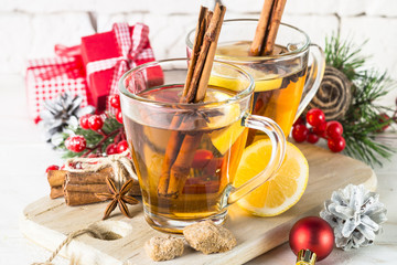 Winter hot tea with lemon and spices