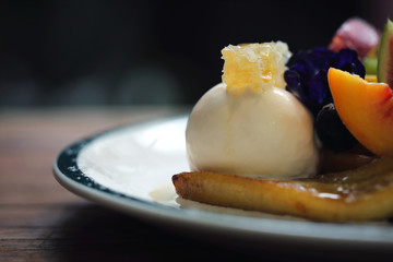 Dessert baked Waffle with fruits kiwo grape berry and vanilla ice cream vintage style