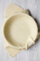 Raw dough for preparation apple pie, overhead view.