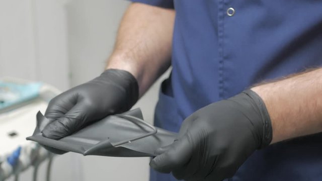 Dentistry rubber dam (cofferdam) installation procedure. Dental treatment, modern technology