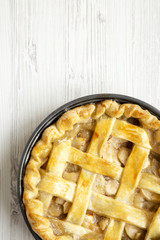 Homemade apple pie on white wooden background, view from above. Flat lay, overhead, top view. Copy...
