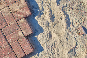 Background wich bricks and sand, road works